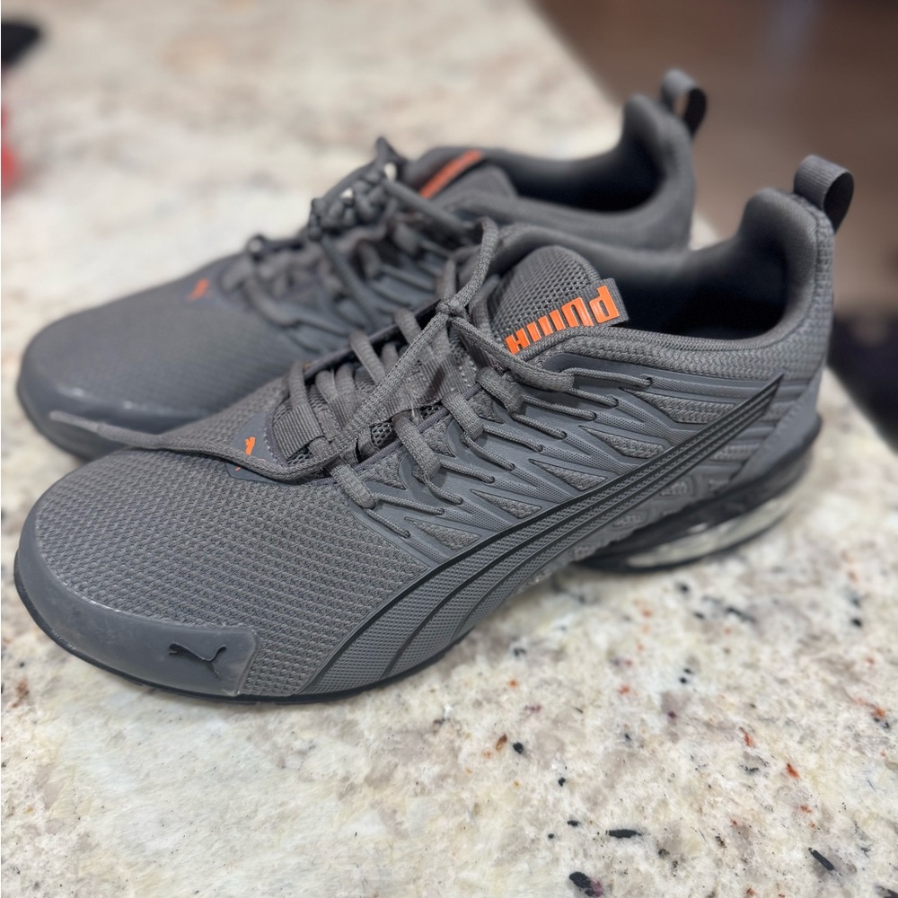 Men’s Puma Charcoal Sneakers with Vibrant Orange Highlights